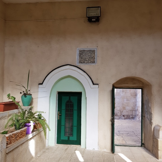 The courtyard of the little mosque right next to the chapel of the ascension. The door to the family's home (who guard her tomb) is here